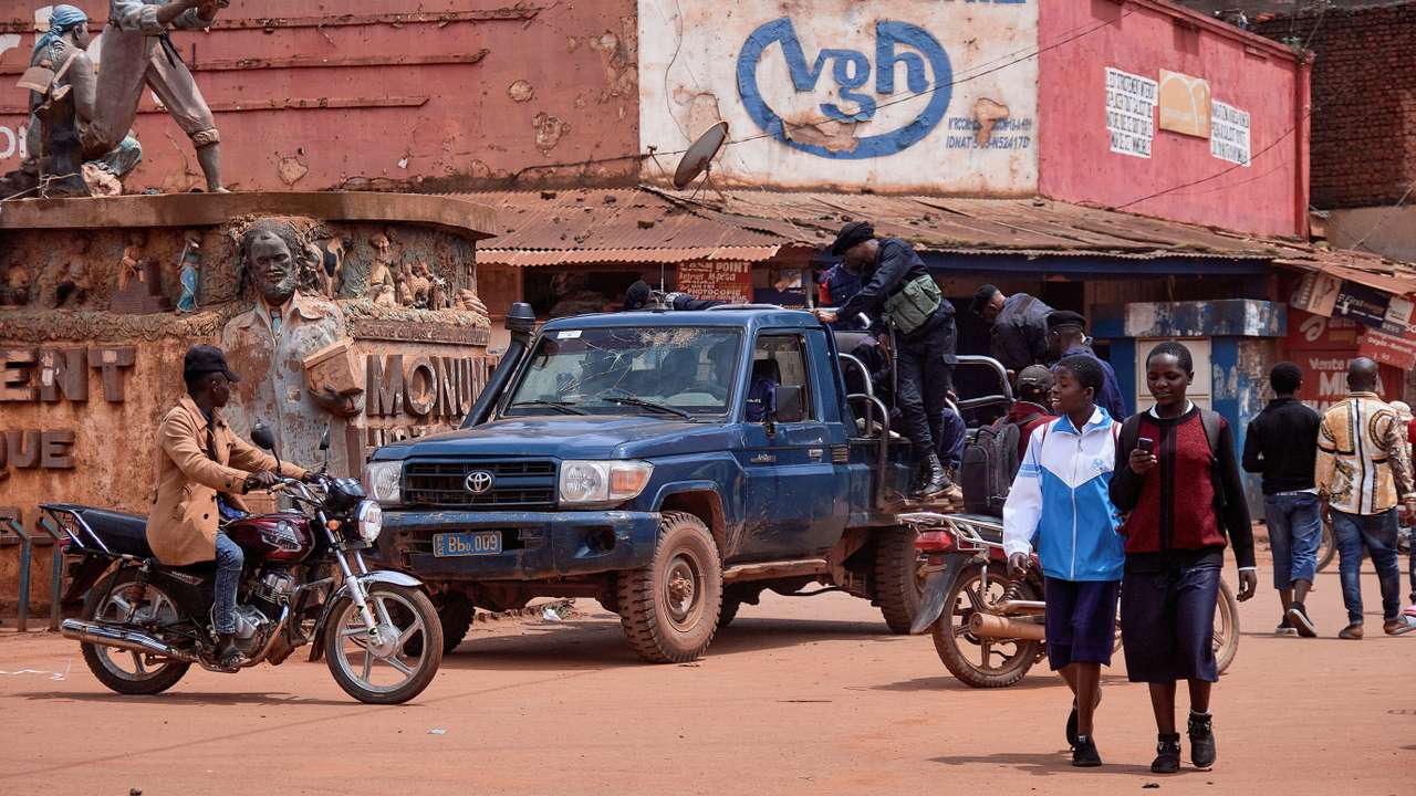 FILE PHOTO: Congolese police officers patrol on their pick-up truck near the Historical monument of Butembo at an intersection of streets in Butembo