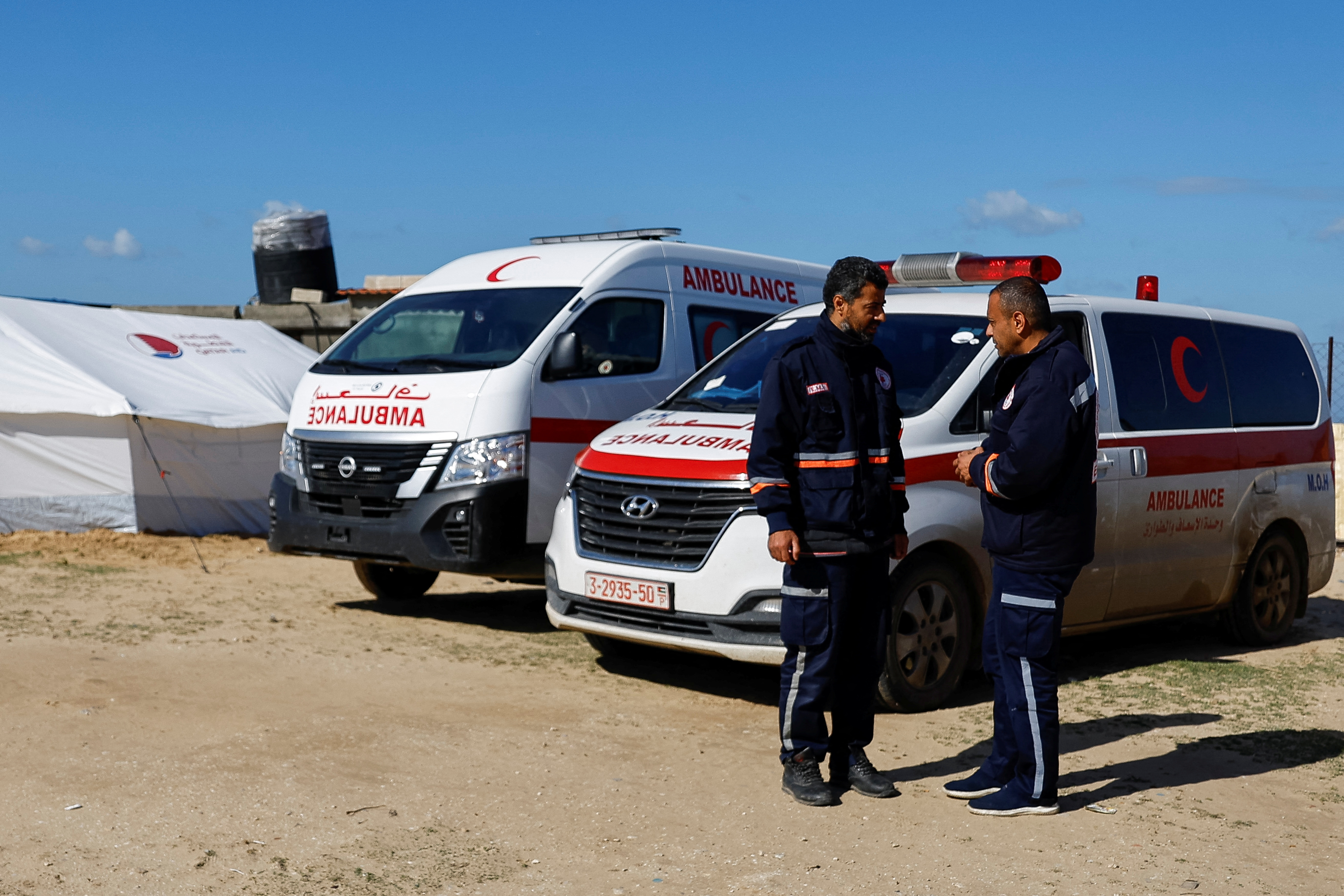 Medics help Palestinians, at a medical point formed to get better access to frontlines, in Khan Younis in the southern Gaza Strip