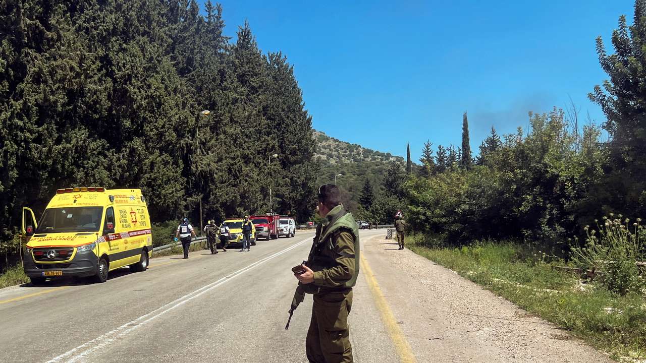 An Israeli soldier looks on after it was reported that people were injured, amid ongoing cross-border hostilities between Hezbollah and Israeli forces, near Arab al-Aramashe