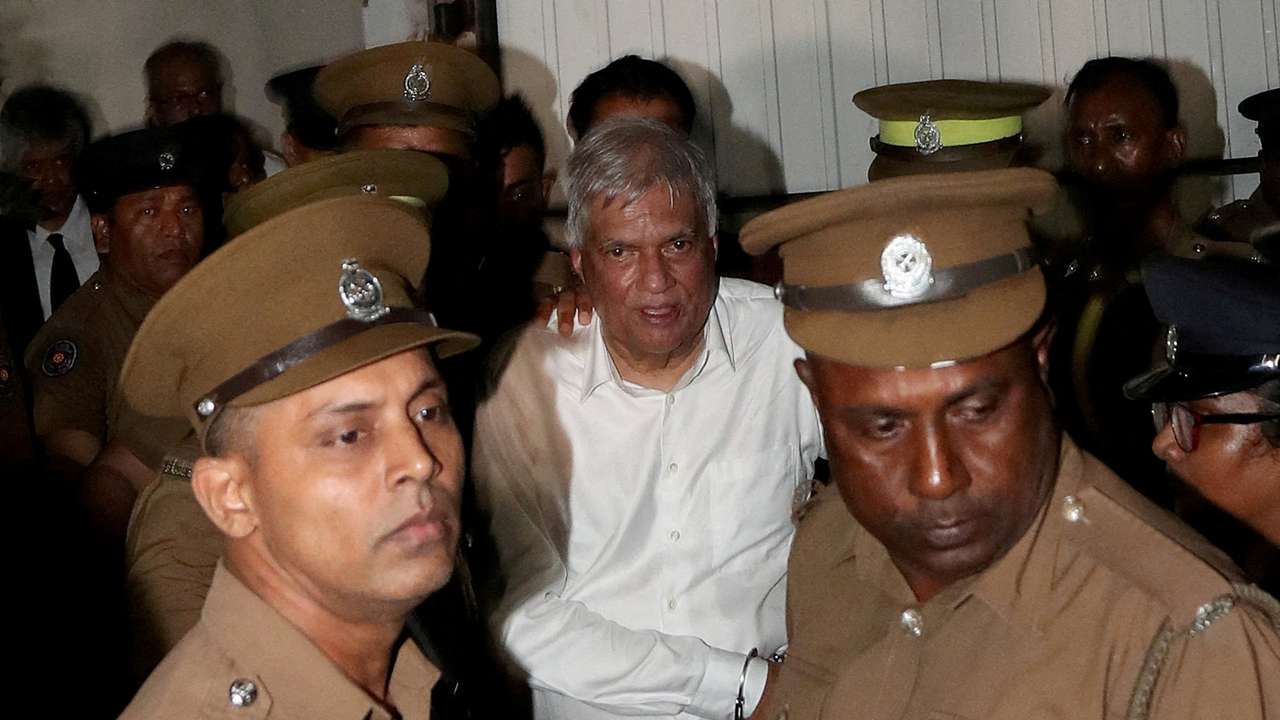 FILE PHOTO: Sri Lanka's former President Wickremesinghe is escorted by prison and police officials as he leaves the Magistrate’s Court in Colombo