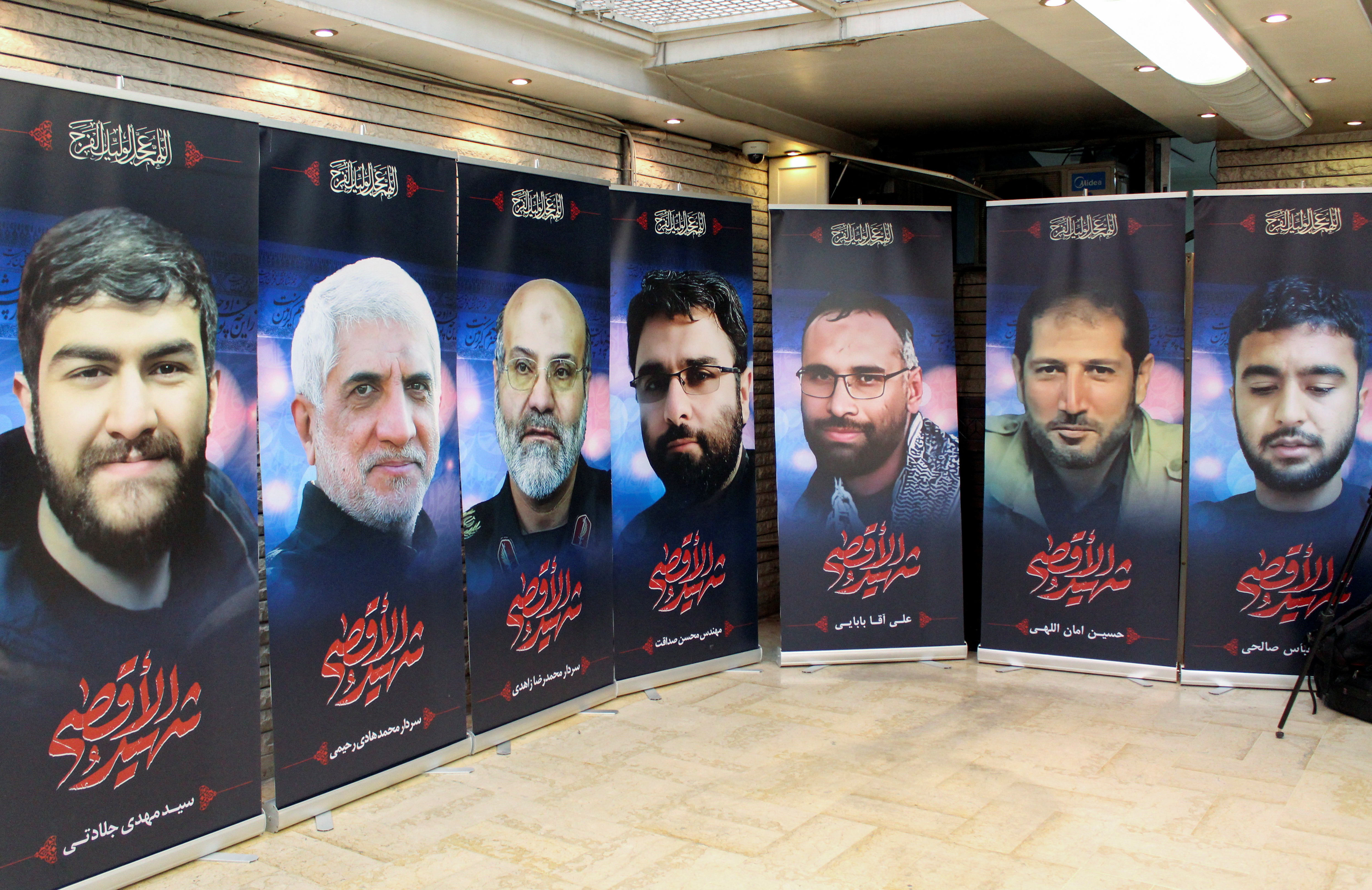 Posters depicting Iranians who were killed in a suspected Israeli airstrike, are displayed at the Iranian embassy in Damascus