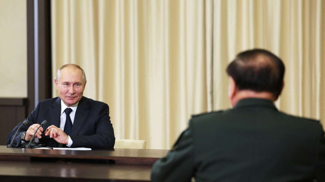 Russian President Vladimir Putin meets Defence Minister Sergei Shoigu and vice chairman of China's Central Military Commission General Zhang Youxia outside Moscow