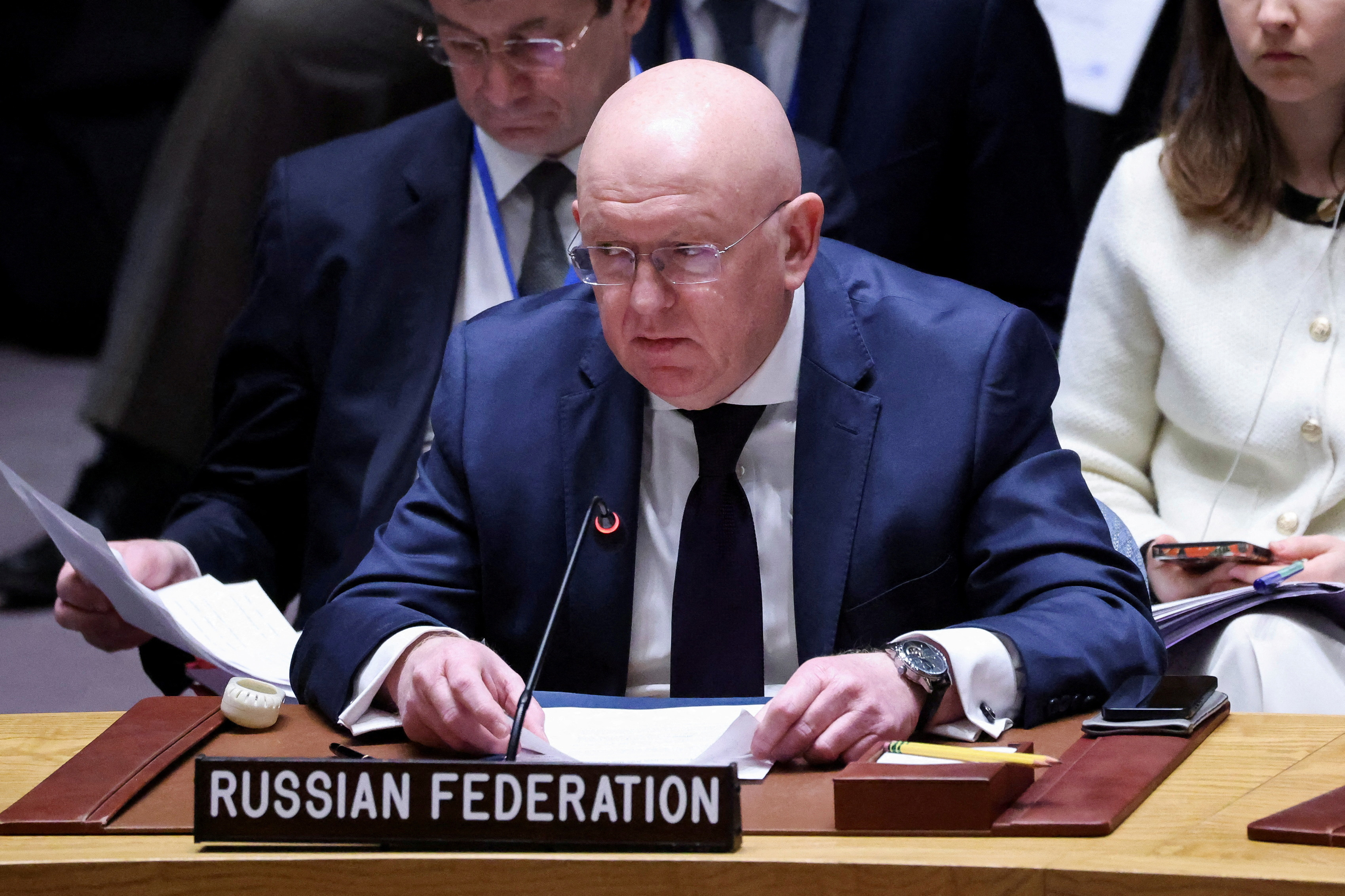 FILE PHOTO: Members of the United Nations Security Council vote on a Gaza resolution that demands an immediate ceasefire, in New York
