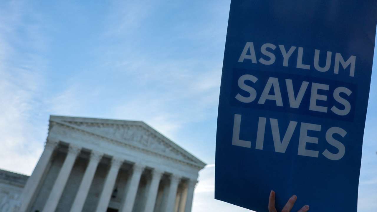 Demonstrators gather for a vigil prior to arguments in Noem v. Al Otro Lado at the U.S. Supreme Court building in Washington