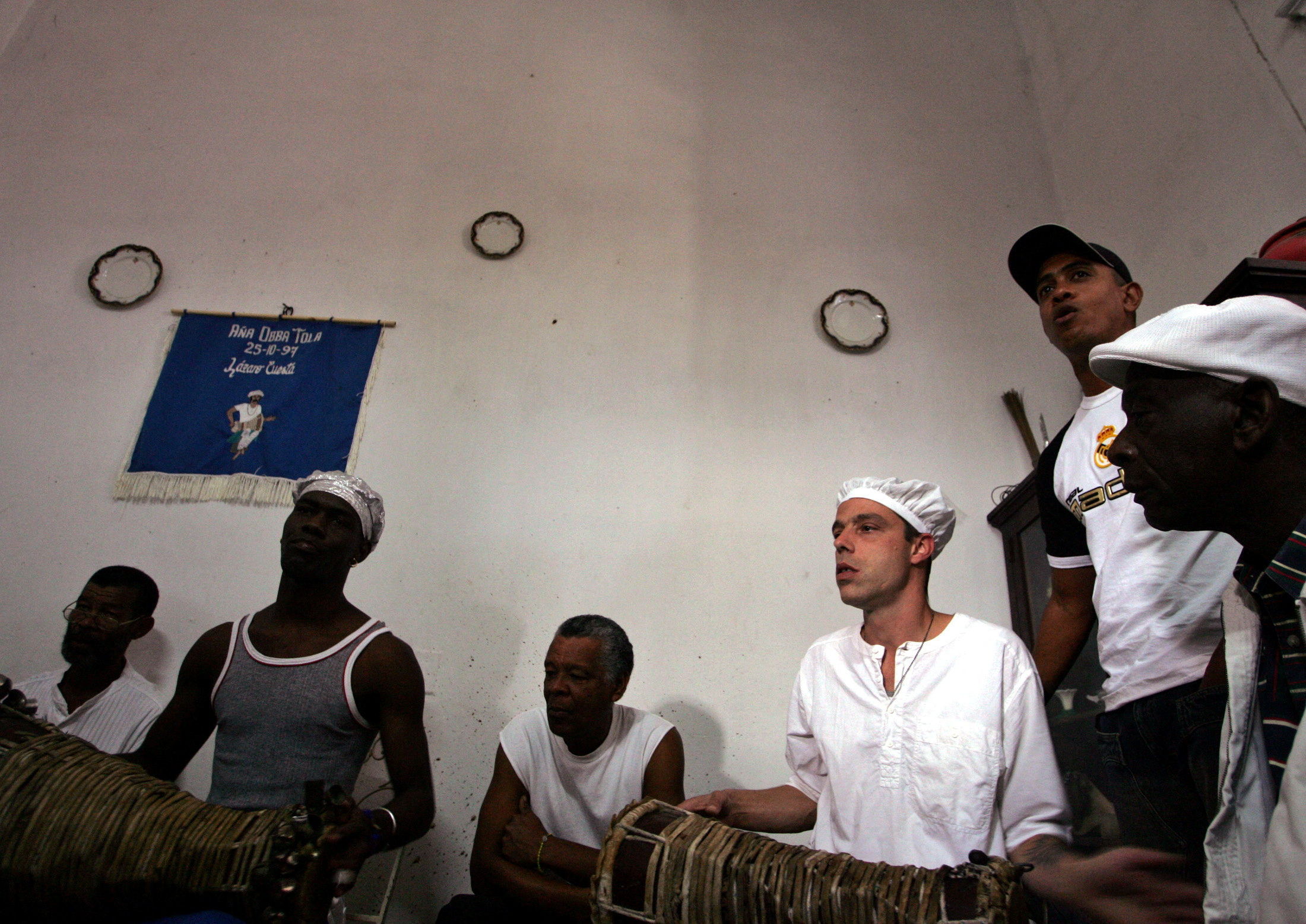 FILE PHOTO: Cuban babalawos play drums during Cuban Santeria religious ceremony in Havana