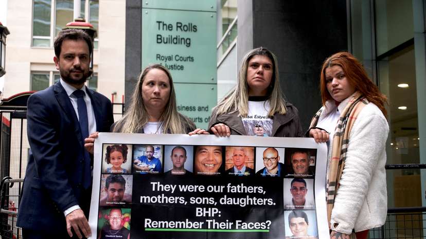 Victims of Brazilian dam stand outside City Court House, Rolls Building in London