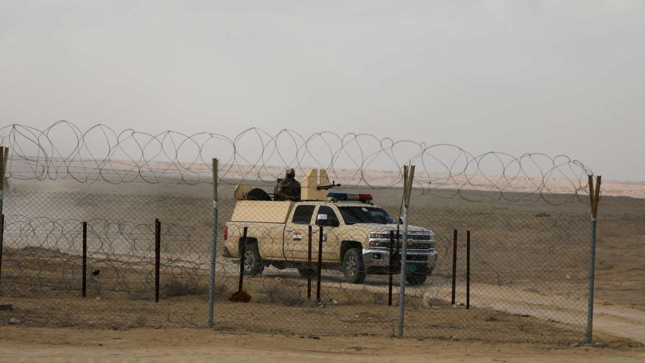 FILE PHOTO: Iraqi military vehicle patrols near Iraqi-Syrian border