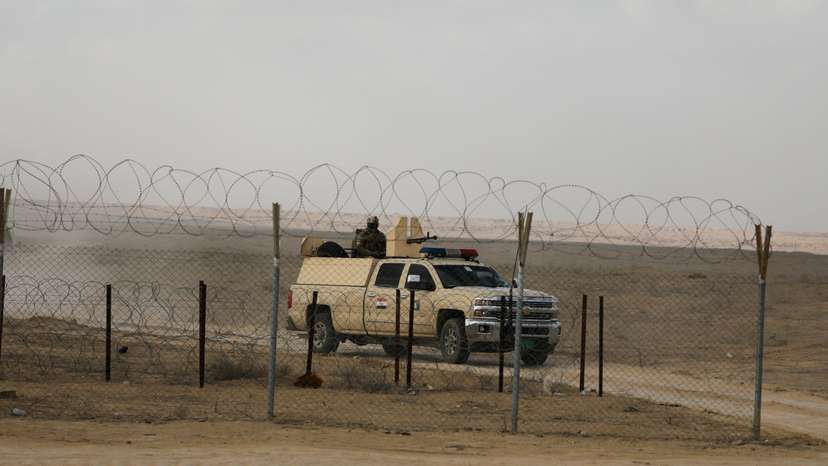 FILE PHOTO: Iraqi military vehicle patrols near Iraqi-Syrian border