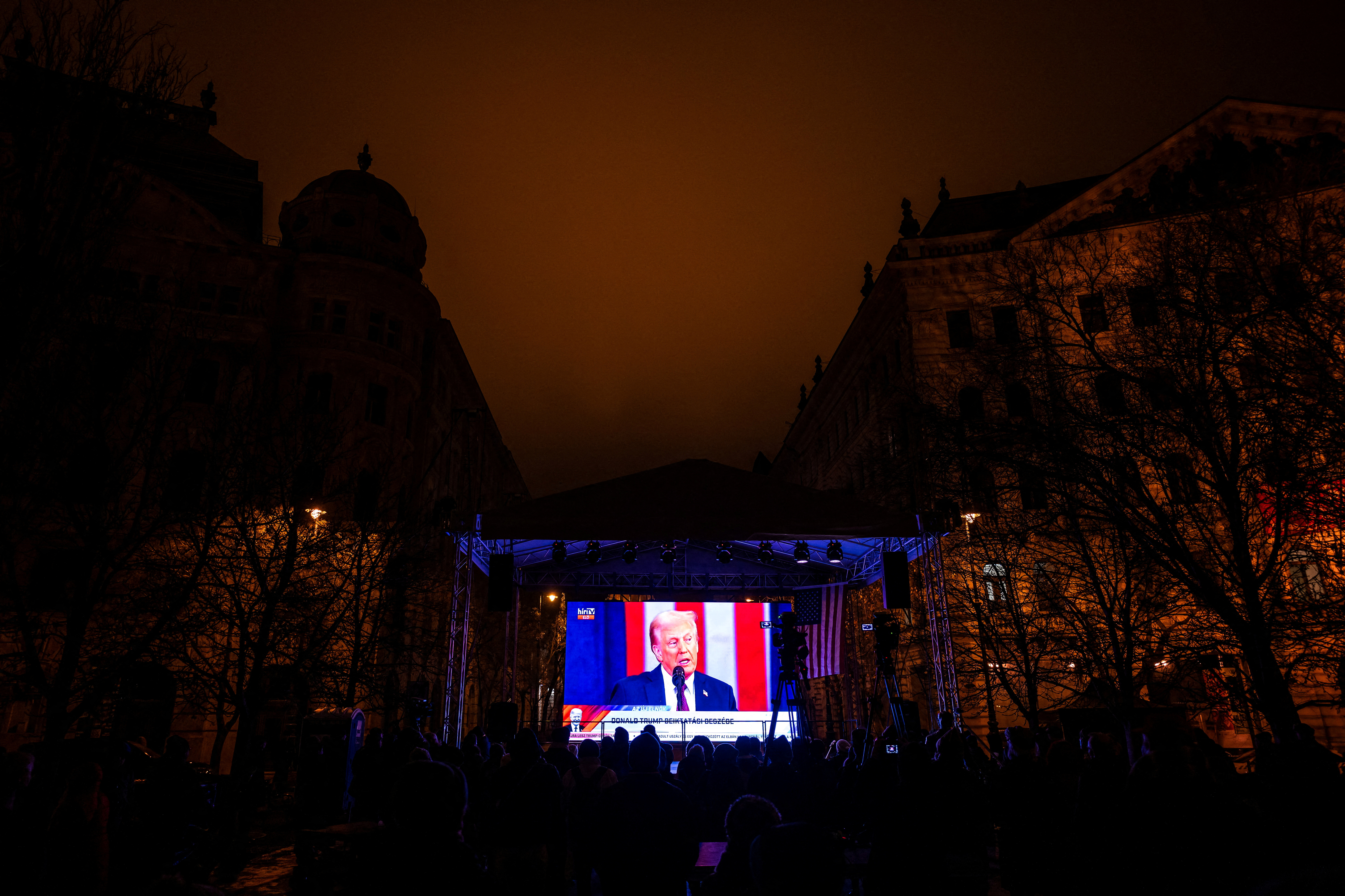Hungarian fans of incoming U.S. President Donald Trump celebrate his return to the White House