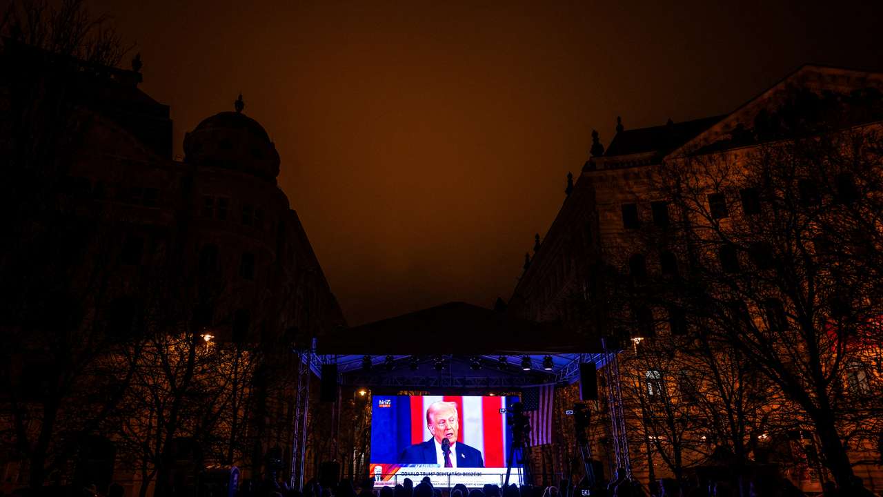 Hungarian fans of incoming U.S. President Donald Trump celebrate his return to the White House