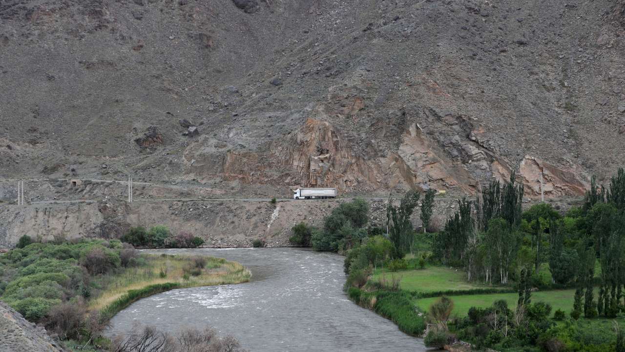 FILE PHOTO: A truck drives on a road in the border region of Iran, as seen from the Syunik Province of Armenia