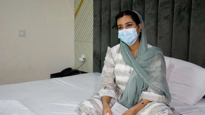 Kimia, 25, an Afghan journalist and artist, speaks with Reuters in Islamabad