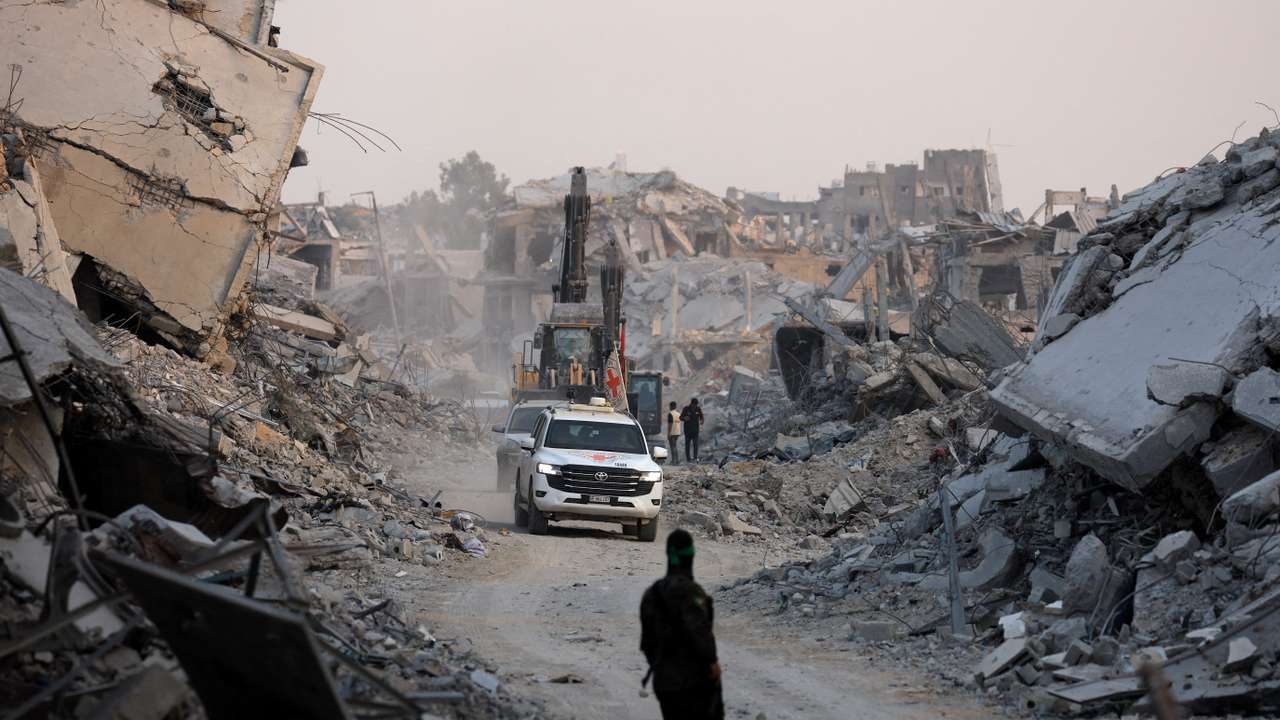 Red Cross vehicles drive, after Hamas said that it found the body of an Israeli hostage soldier, in Gaza City
