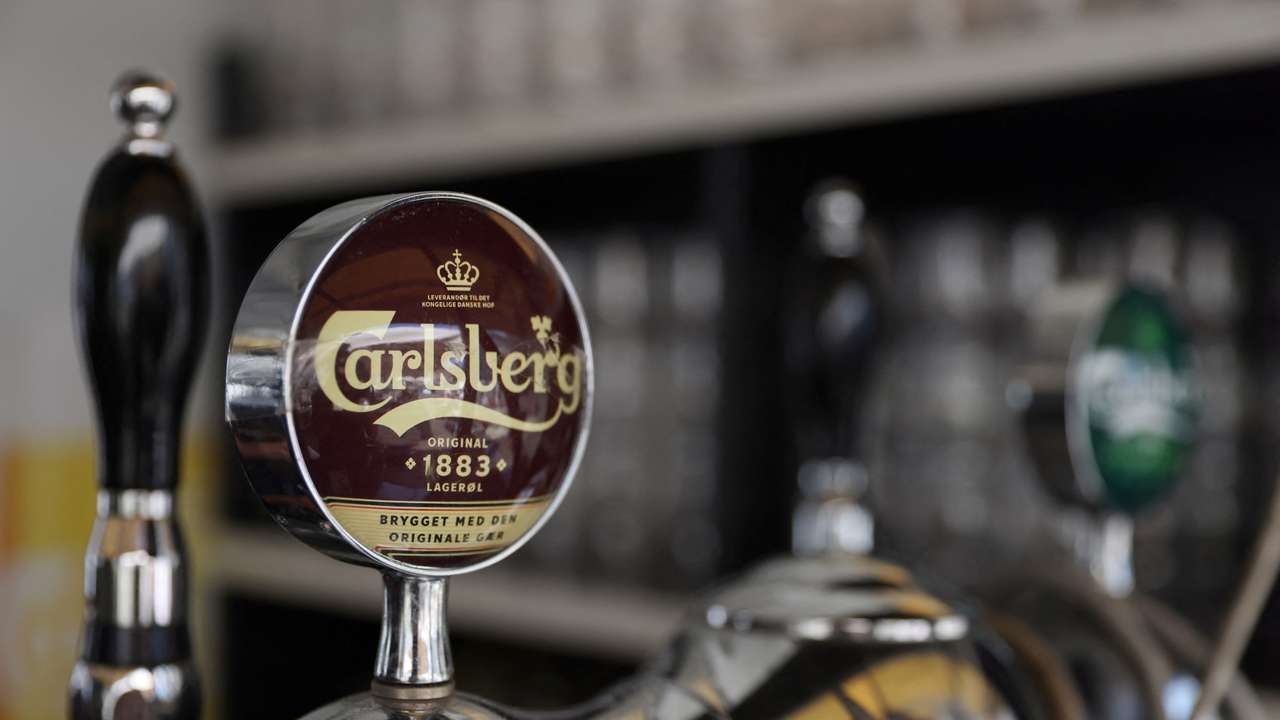 Taps for Carlsberg beer are seen in a bar in Copenhagen