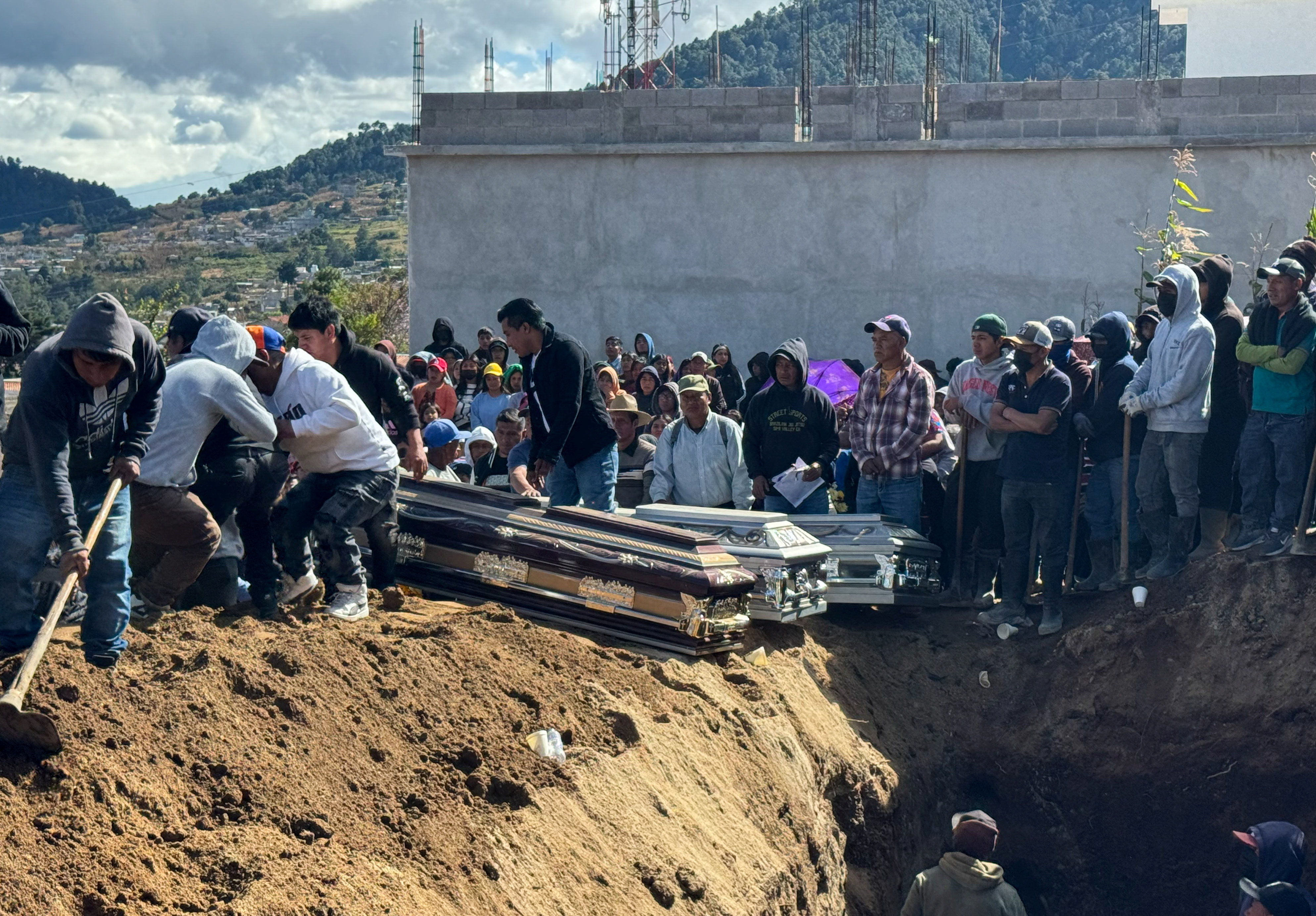 Villagers attend a mass funeral for victims killed during a prolonged attack by heavily armed organized crime groups on a military outpost, as Guatemalan President Bernardo Arevalo declared a 15-day "state of prevention" in the western municipalities of Nahuala and Santa Catarina Ixtahuacan, in Solola Department, in Nahuala, Guatemala, December 14, 2025. REUTERS/Jose Cutz