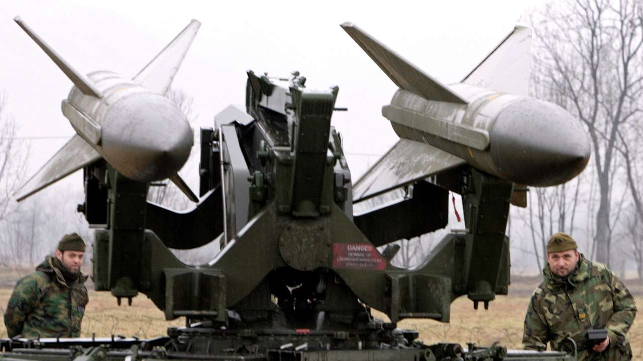 FILE PHOTO: Italian soldiers check a pair of anti-aircraft missiles near the Torino 2006 Winter Olympic Games
