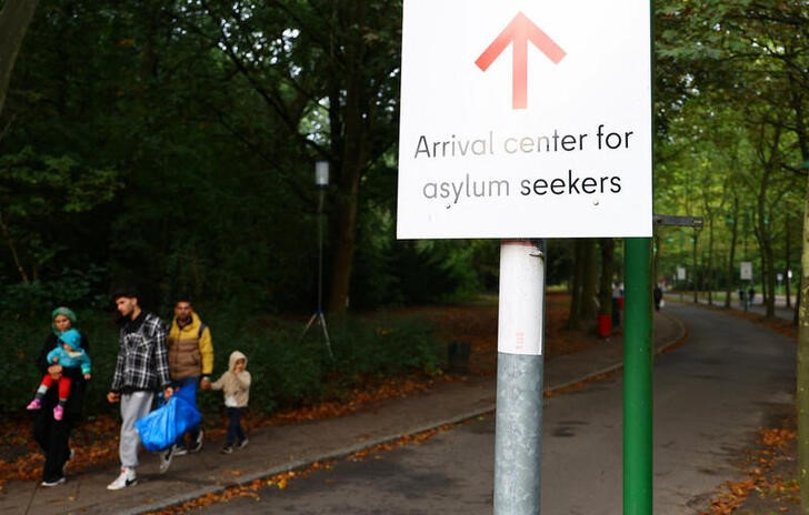 FILE PHOTO: Migrants are pictured at the arrival center for asylum seekers at Berlin's Reinickendorf district