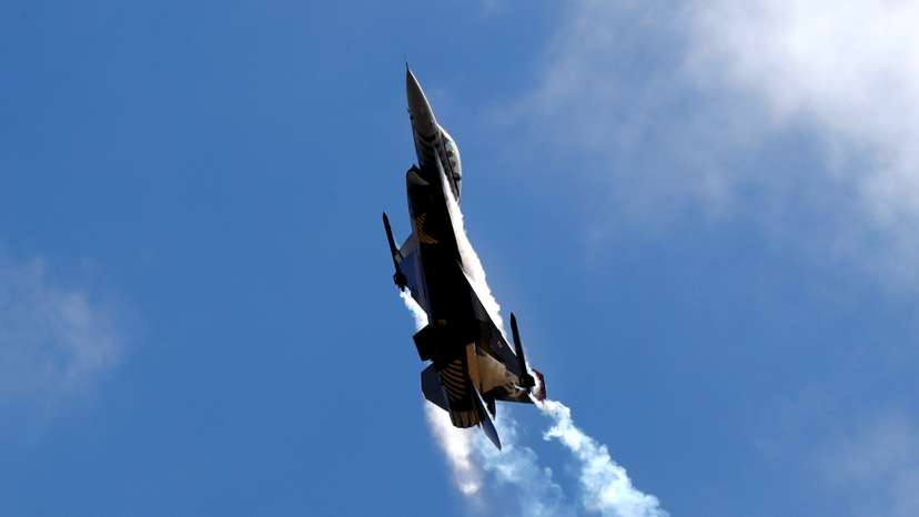An F-16 aircraft of the Turkish Stars aerobatic team of the Turkish Air Force performs during Teknofest airshow over the city's new airport under construction in Istanbul
