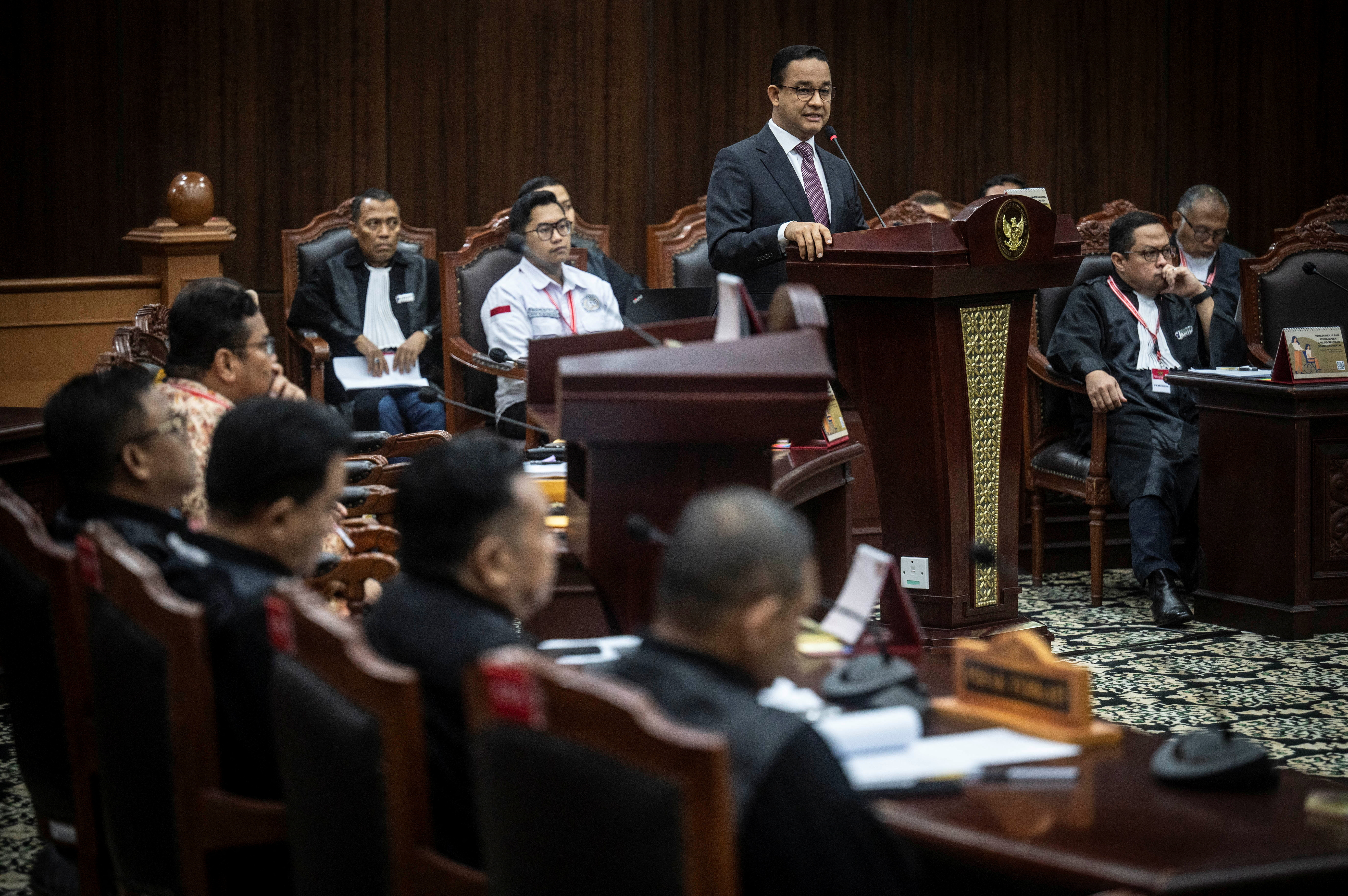 Presidential candidate Anies Baswedan speaks while challenging the election result at Indonesia's constitutional court in Jakarta