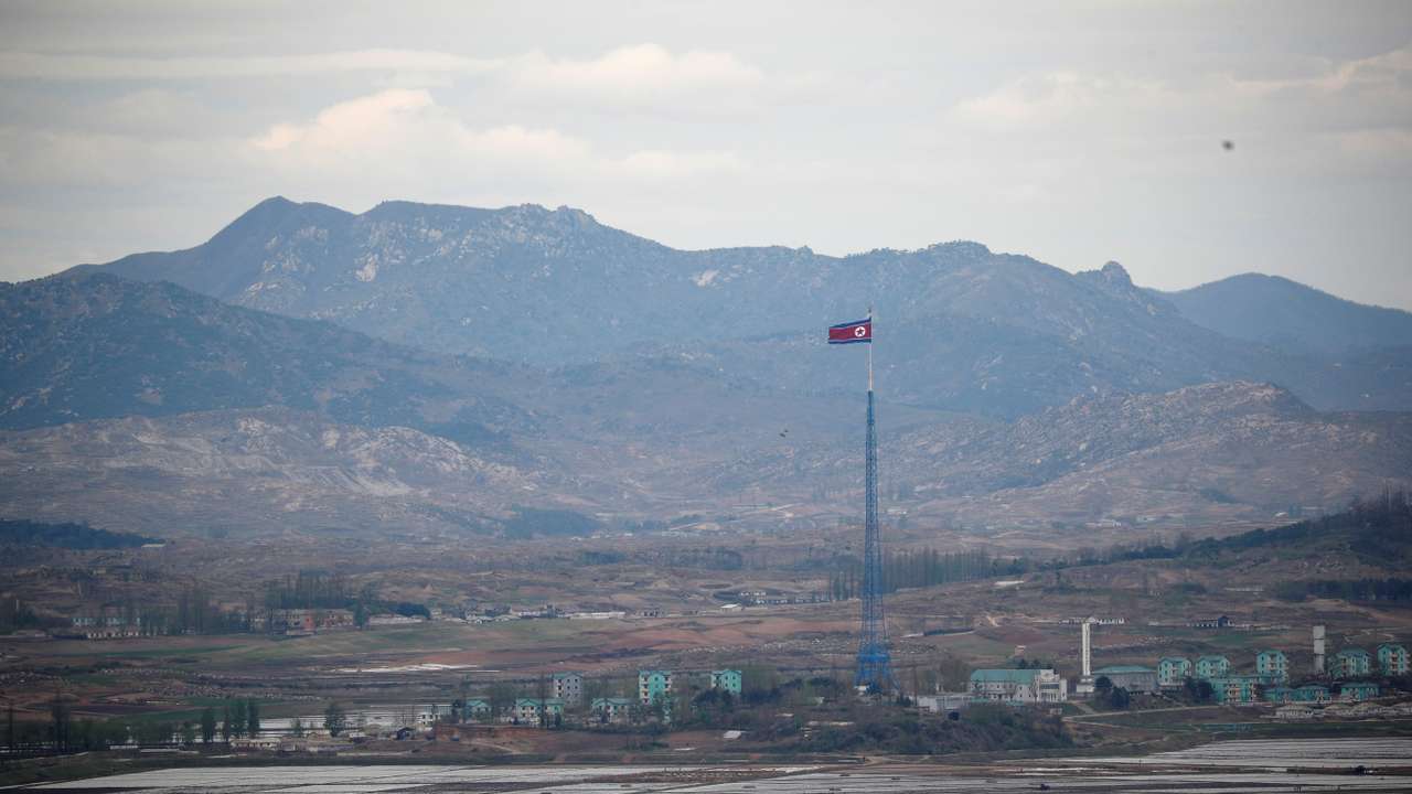 A North Korean flag flutters on top of a 160-metre tower in North Korea's propaganda village of Gijungdong, in this picture taken from the Dora observatory near the demilitarised zone separating the two Koreas, in Paju
