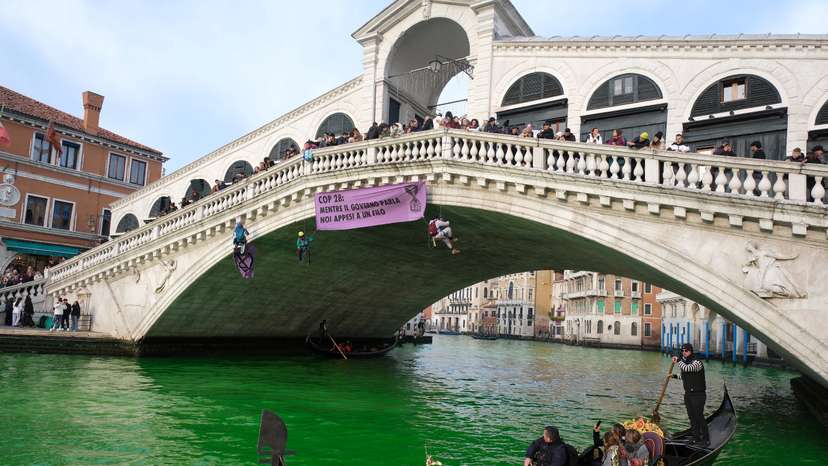 Waters of Grand Canal turned green after a protest by 'Extinction Rebellion' climate activists in Venice