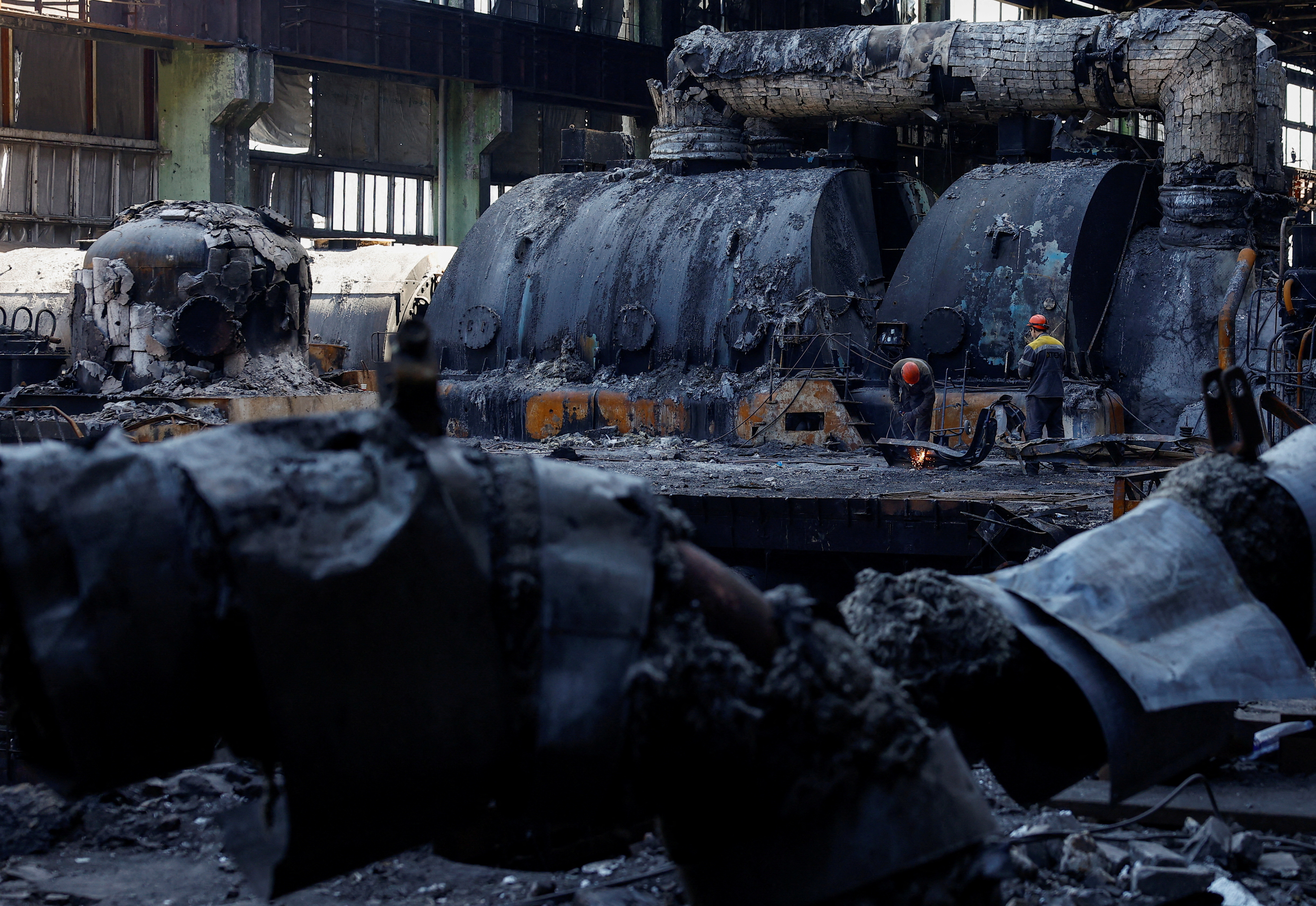 FILE PHOTO: Employees work at a thermal power plant heavily damaged by recent Russian missile strikes in Ukraine