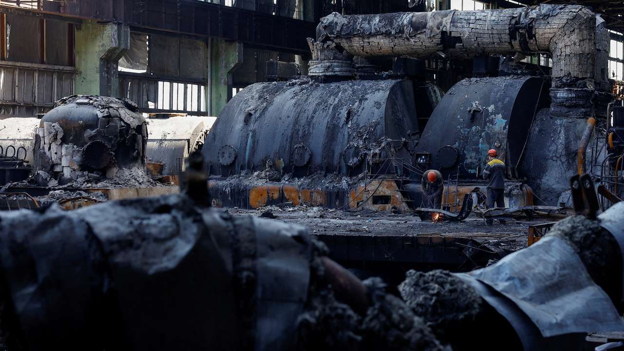 FILE PHOTO: Employees work at a thermal power plant heavily damaged by recent Russian missile strikes in Ukraine