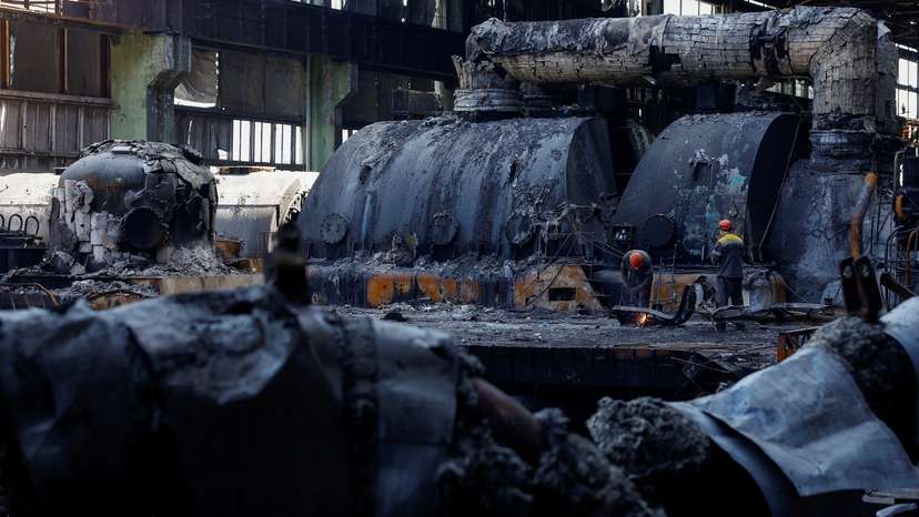 FILE PHOTO: Employees work at a thermal power plant heavily damaged by recent Russian missile strikes in Ukraine