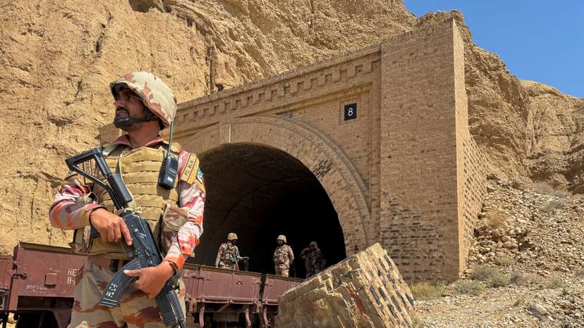 FILE PHOTO: Pakistan army soldiers stand at a tunnel where a train was attacked by separatist militants, in Bolan