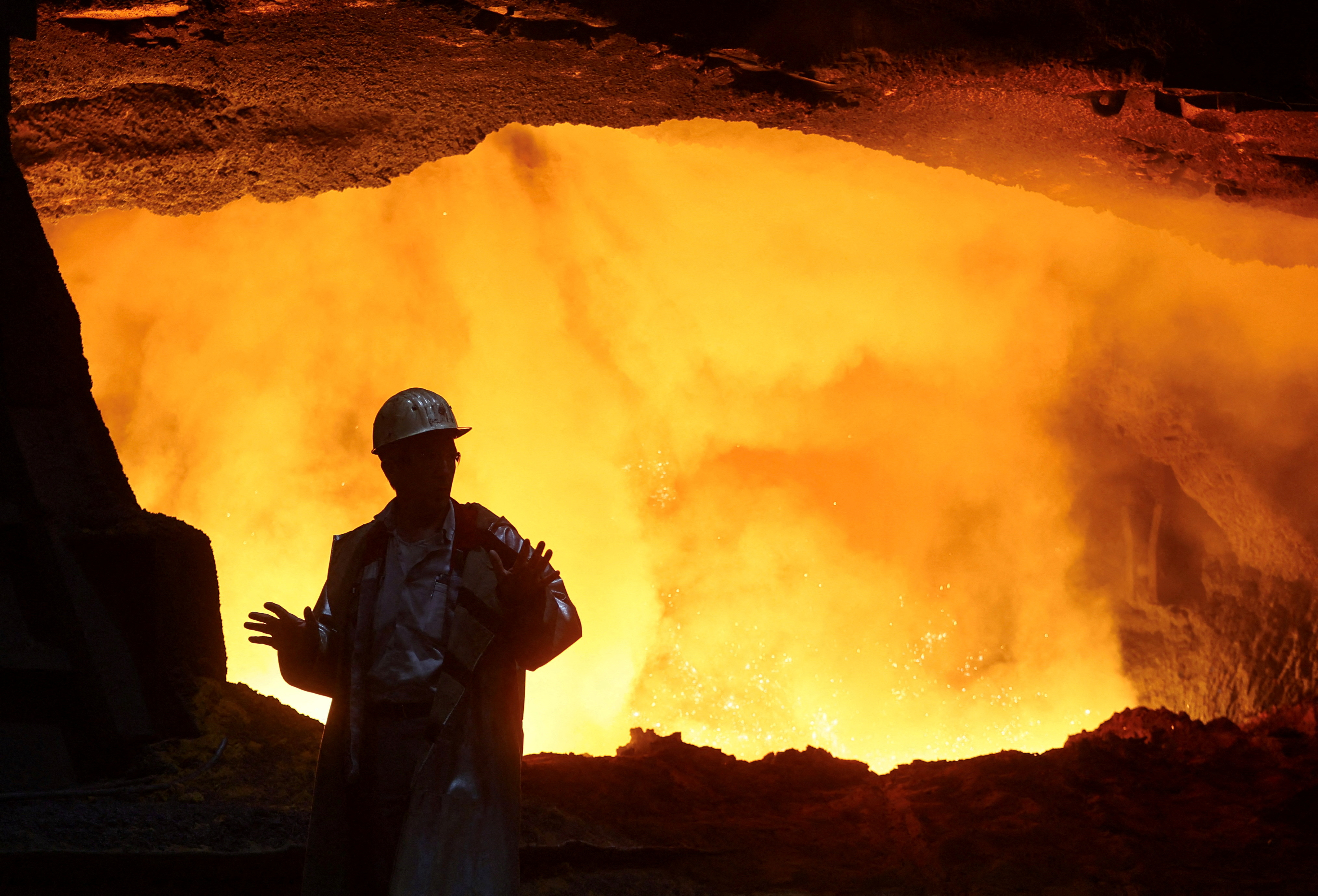 Steel worker at furnace of ThyssenKrupp's steel plant in Duisburg