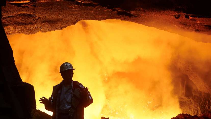 Steel worker at furnace of ThyssenKrupp's steel plant in Duisburg
