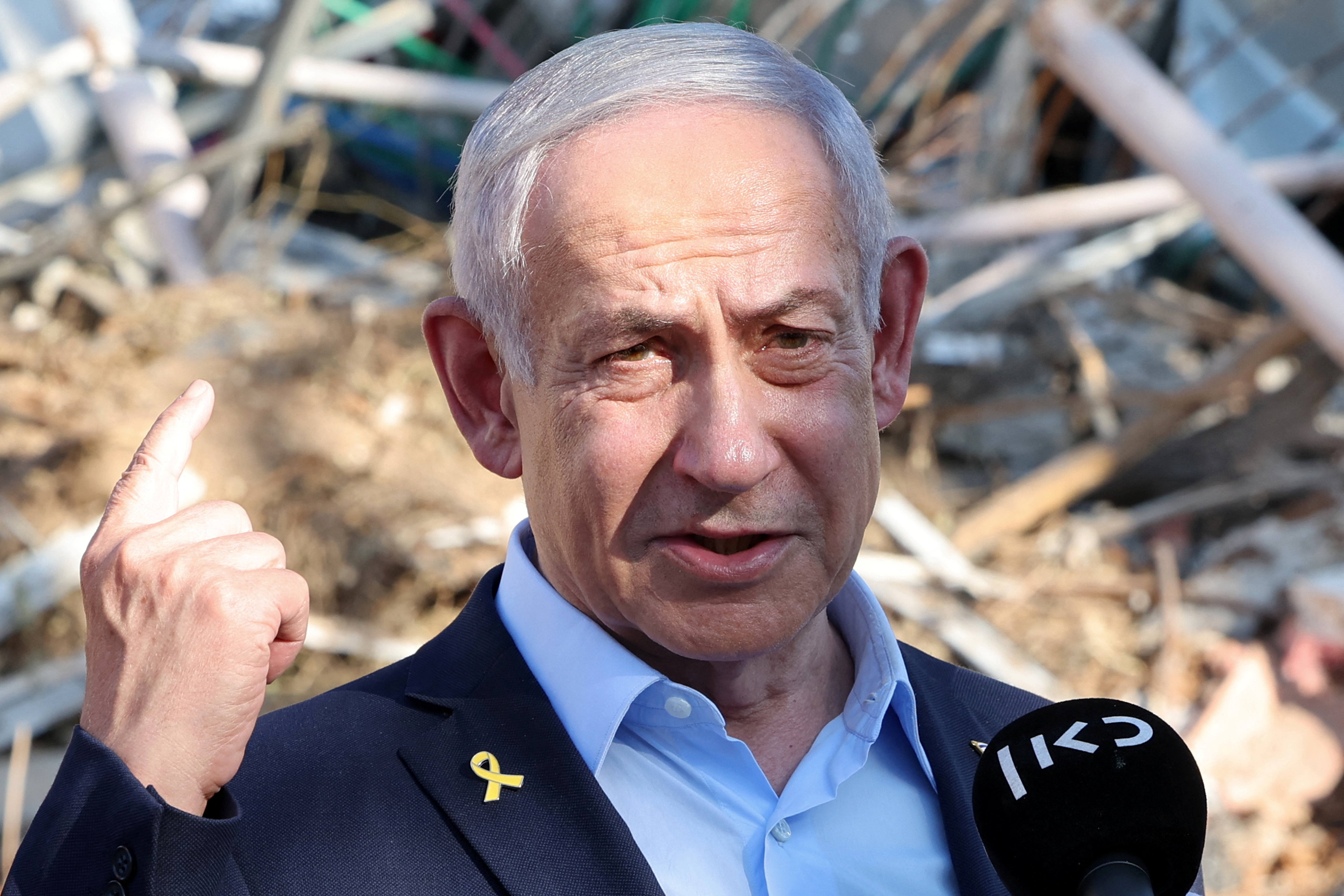 Israel's Prime Minister Benjamin Netanyahu gives a statement during a visit to the site of the Weizmann Institute of Science, which was hit by an Iranian missile barrage, in Rehovot