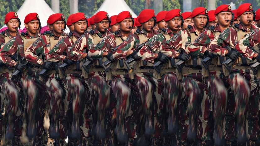 FILE PHOTO: Indonesian Military Special Forces personnel march during the 79th Indonesian Military Anniversary celebrations at the National Monument (Monas) complex in Jakarta