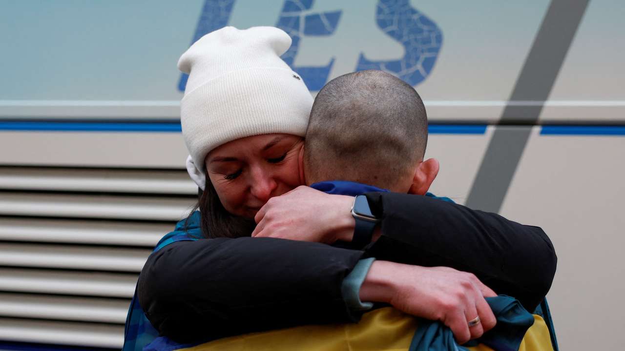 Ukrainian prisoners of war (POWs) return after a swap in an undisclosed location in Ukraine