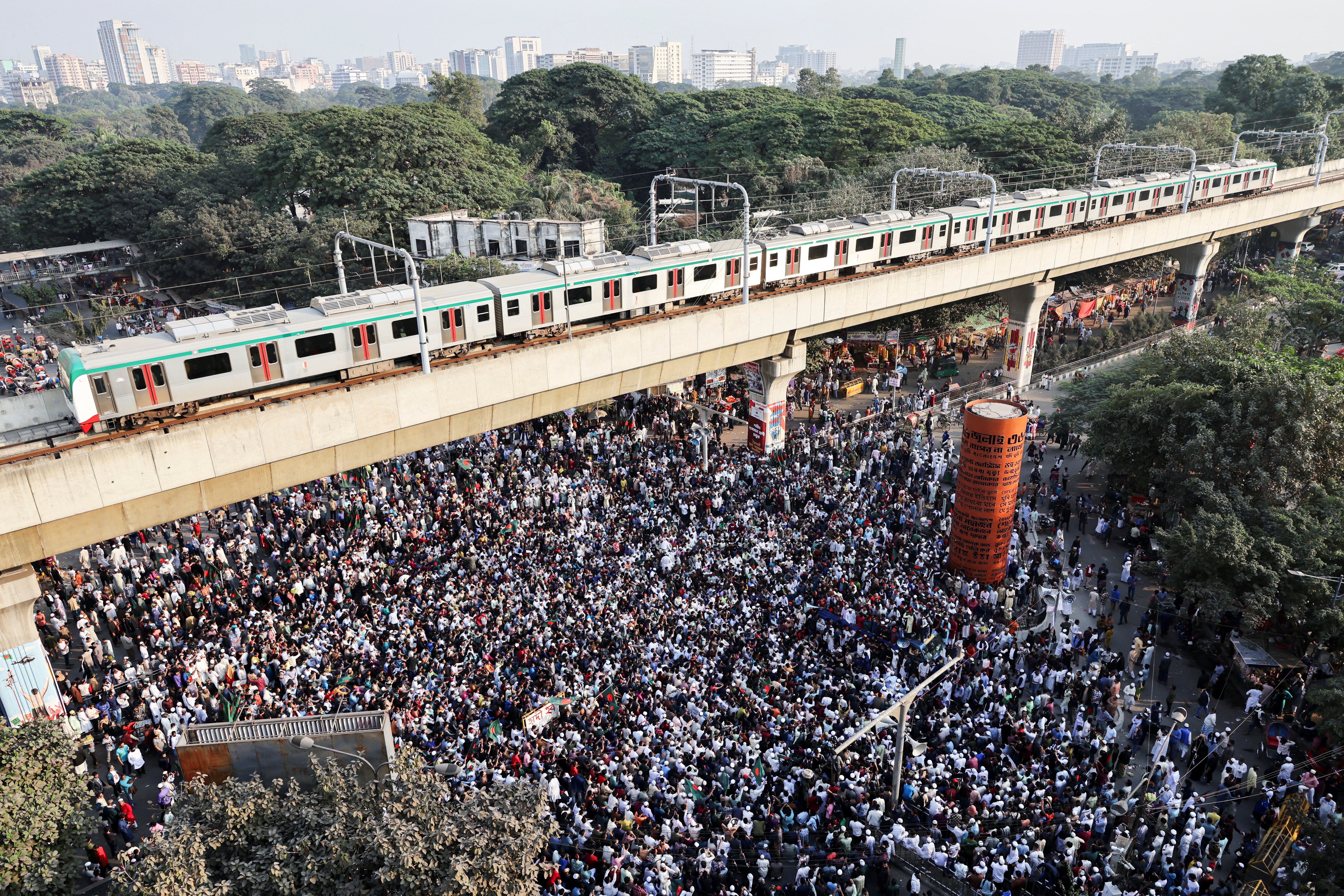 Supporters block the Shahbagh Square as they protest demanding justice for the death of Sharif Osman Hadi, in Dhaka
