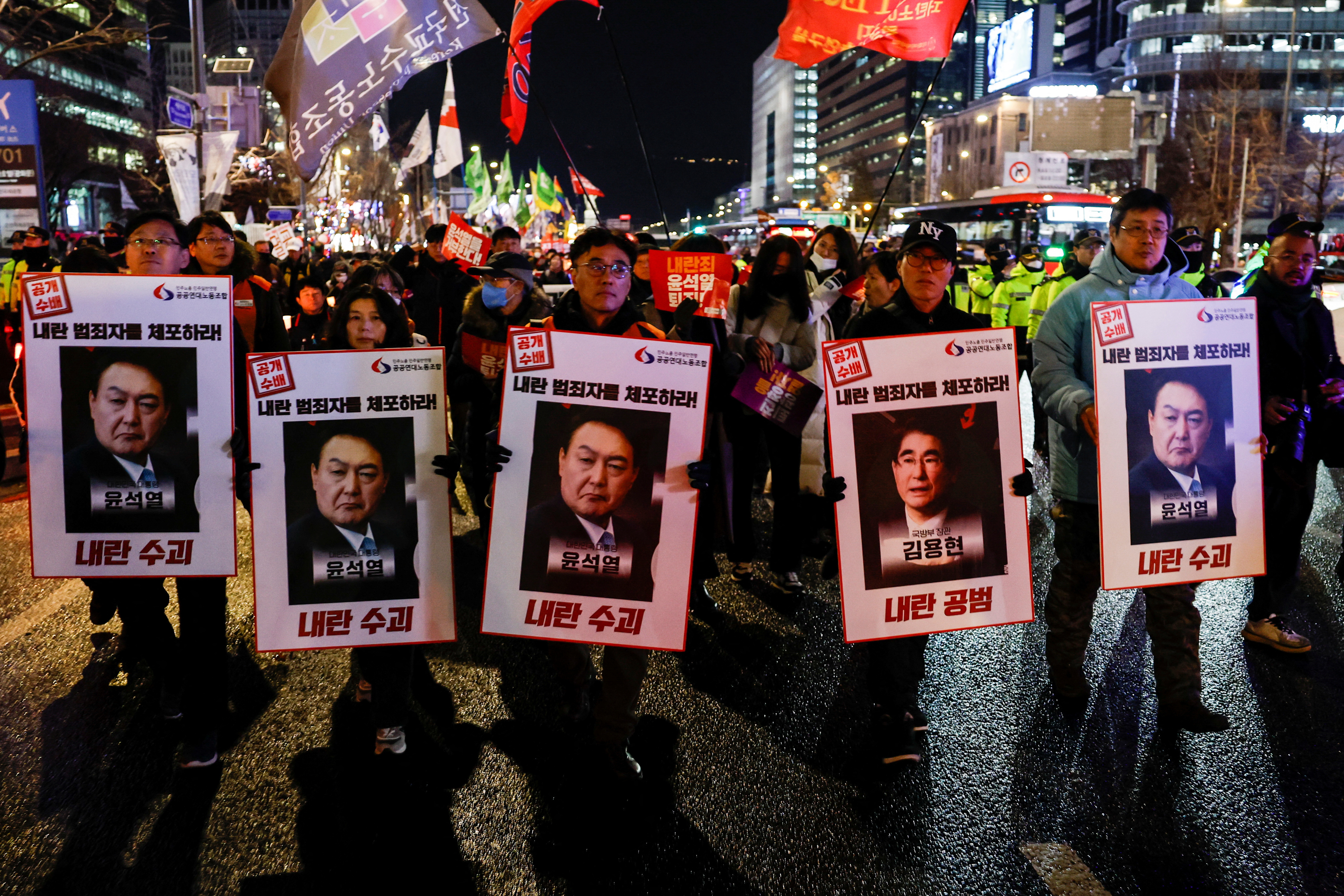 People protest during a candlelight vigil calling for the resignation of South Korean President Yoon Suk Yeol, in Seoul