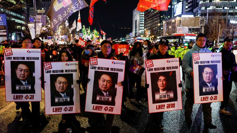People protest during a candlelight vigil calling for the resignation of South Korean President Yoon Suk Yeol, in Seoul