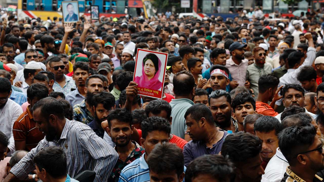 Supporter of Bangladesh Nationalist Party (BNP) holds a picture of former Prime Minister Khaleda Zia while joining in a rally, days after the resignation of former Prime Minister Sheikh Hasina