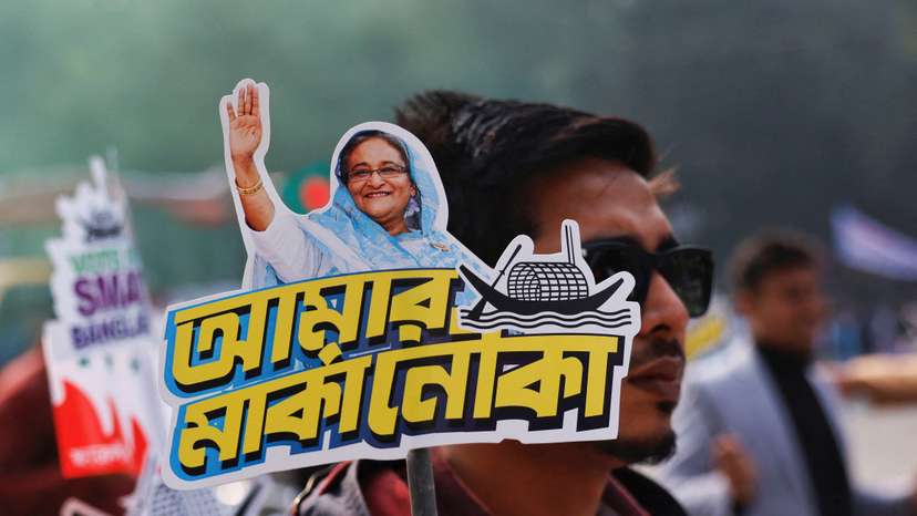 FILE PHOTO: A student holds a placard of Prime Minister Sheikh Hasina as they celebrate the formation day of Bangladesh Chhatra League, in Dhaka