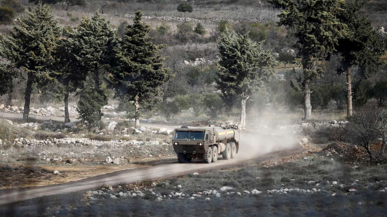 An Israeli military vehicle drives on the Syrian side of the ceasefire line