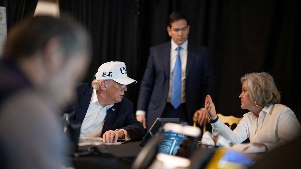 U.S. President Donald Trump speaks with White House Chief of Staff Susie Wiles during military operations in Iran