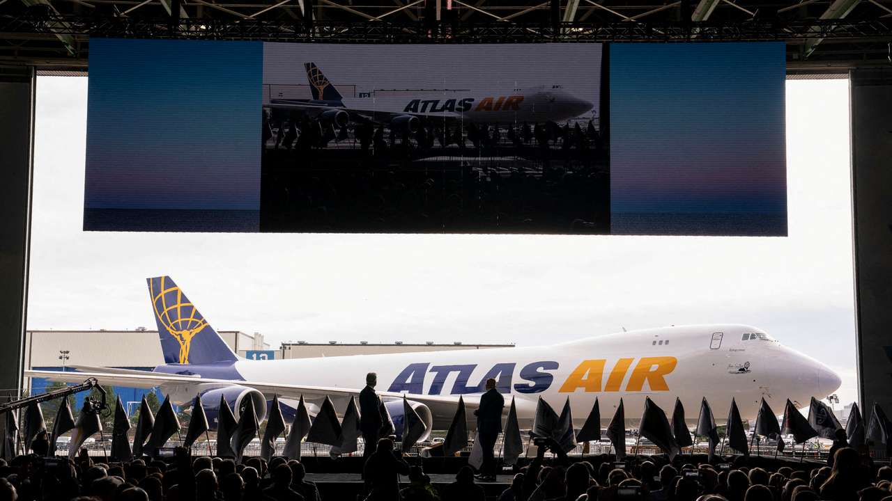 FILE PHOTO: Boeing employees and executives attend the delivery of the final 747 jet in Everett