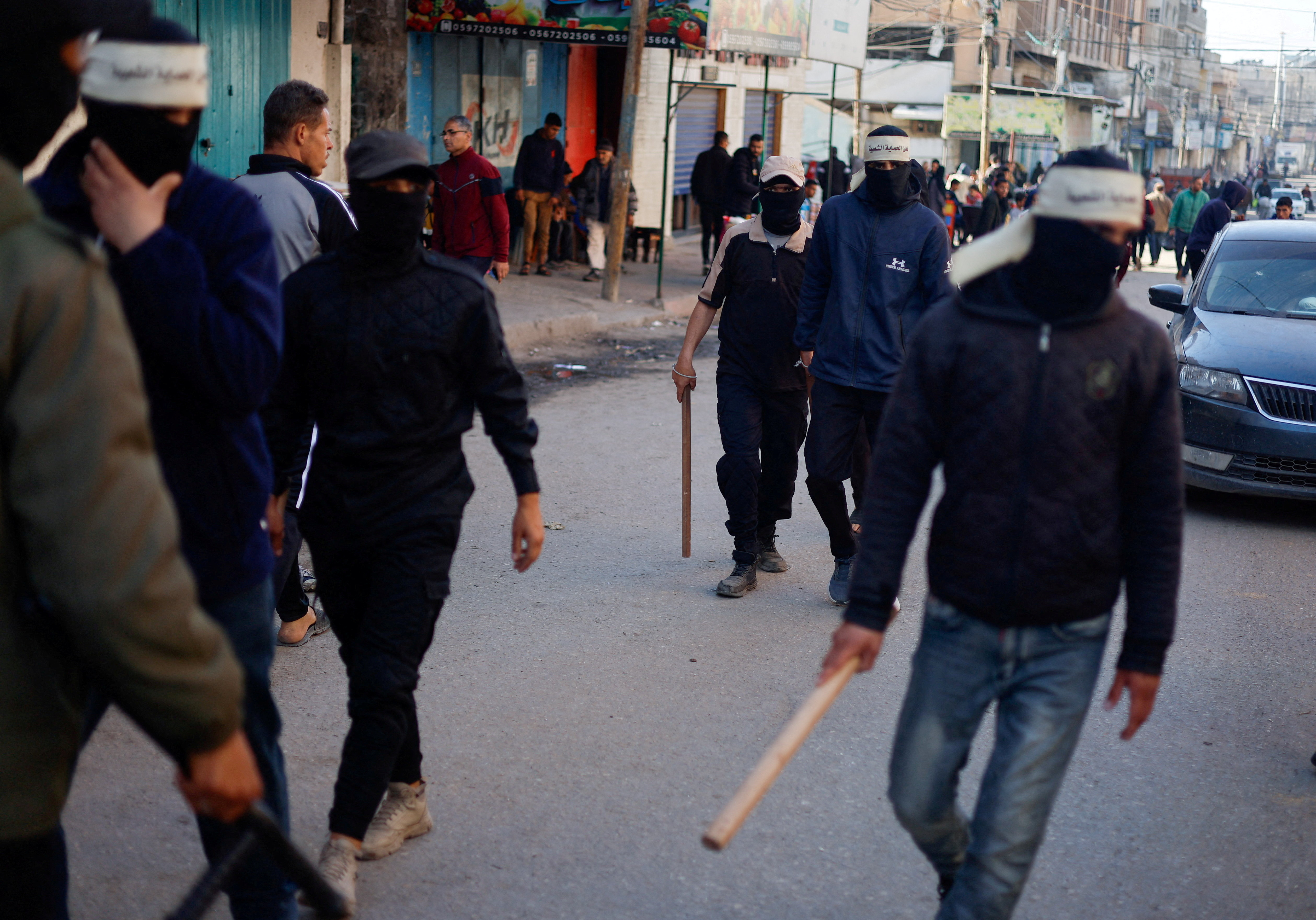 Members of People's Protection Committees work to maintain security and control prices in the market, amid the ongoing conflict between Israel and Hamas, in Rafah in the southern Gaza Strip