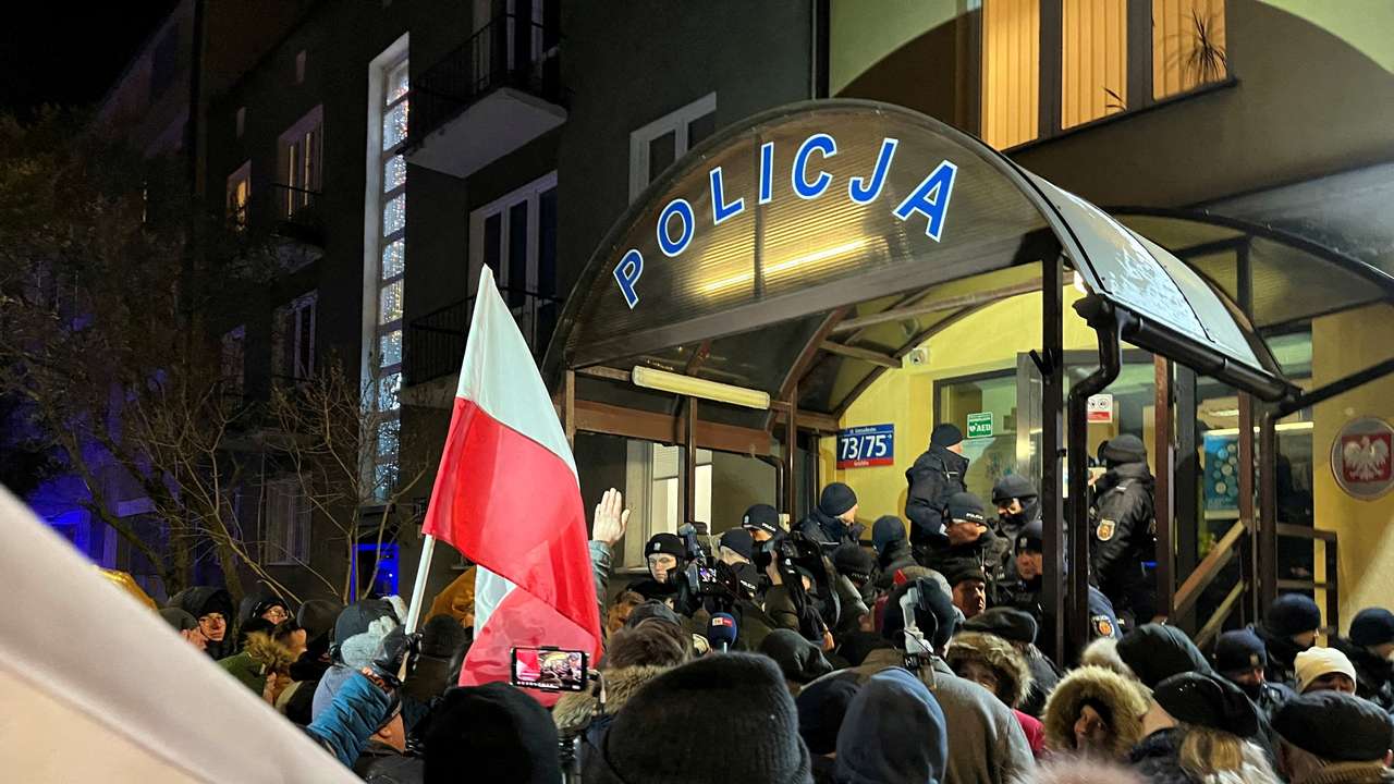 Protesters gather in support of former Interior Minister Kaminski and his deputy Wasik from PiS party, in front of the police station where both politicians are detained in Warsaw