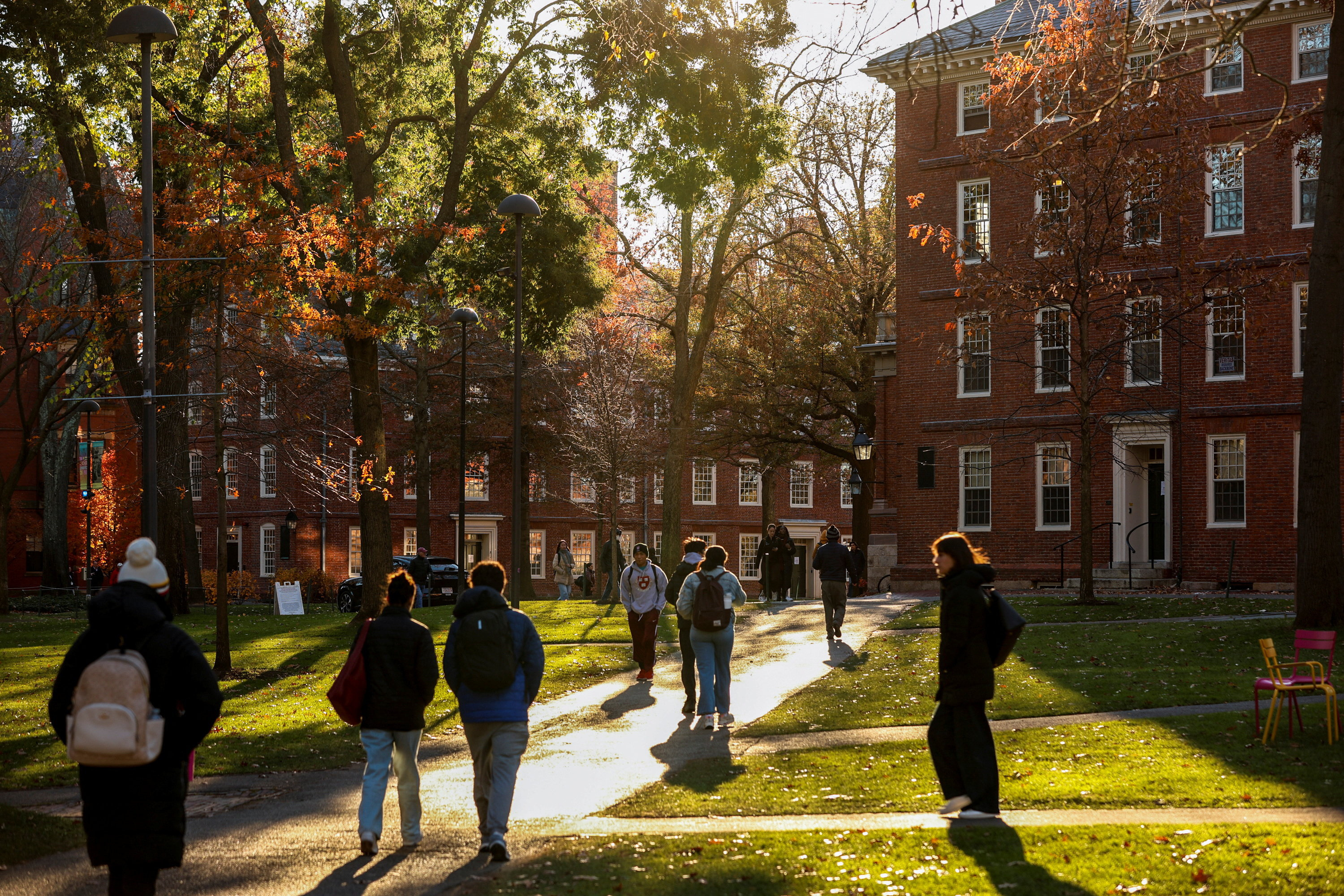 Students walk on the Harvard campus