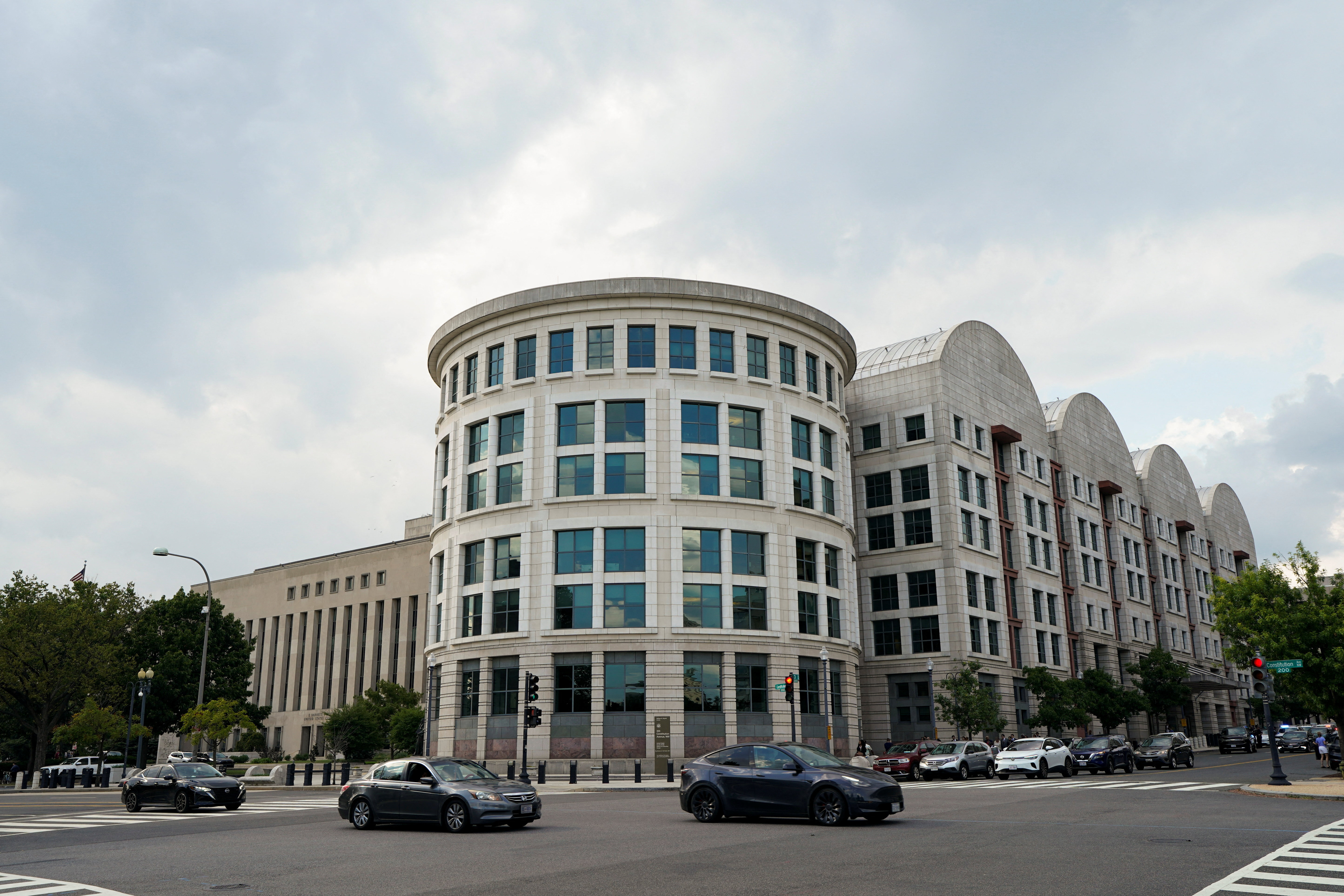 Vehicles drive past the E. Barrett Prettyman U.S. Courthouse in Washington, D.C.