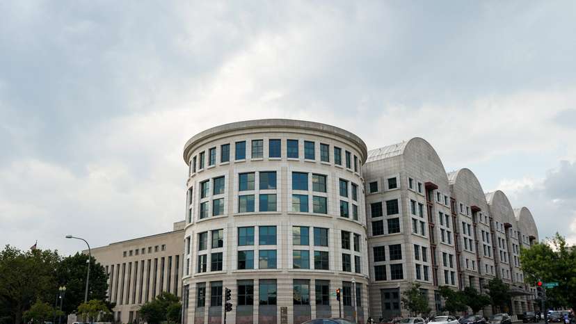 Vehicles drive past the E. Barrett Prettyman U.S. Courthouse in Washington, D.C.