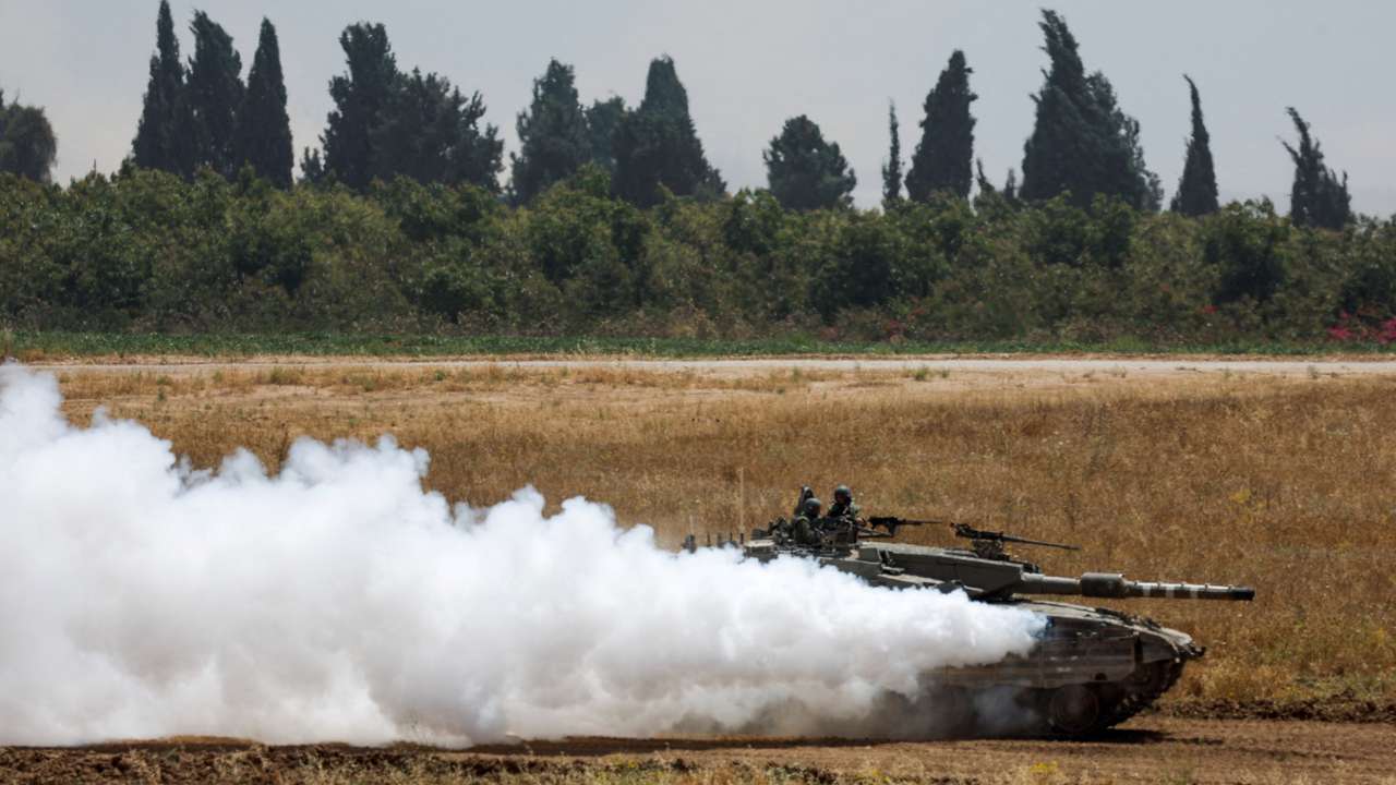 An Israeli tank manoeuvres near the Israel-Gaza border