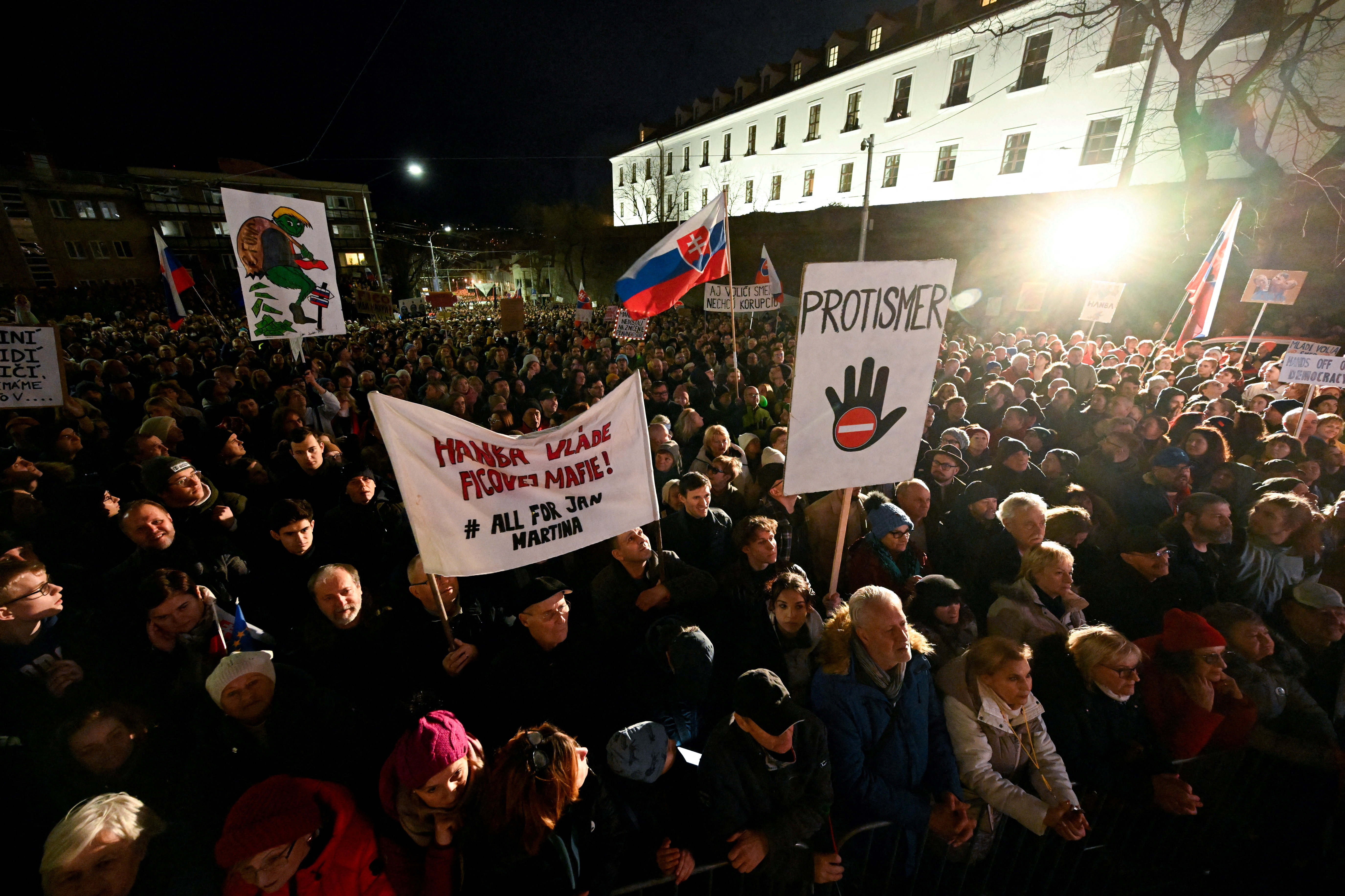 FILE PHOTO: Demonstrators attend a protest against the government's proposal to cancel a branch of prosecution, in Bratislava