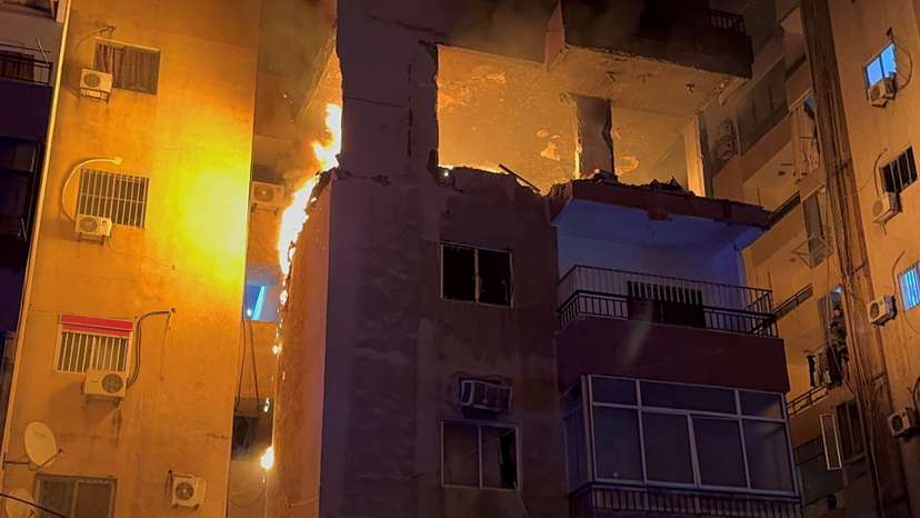 Fire burns at a building floor following an Israeli strike, in which the Israeli military said, it killed Hamas commander Hassan Farhat, in Sidon